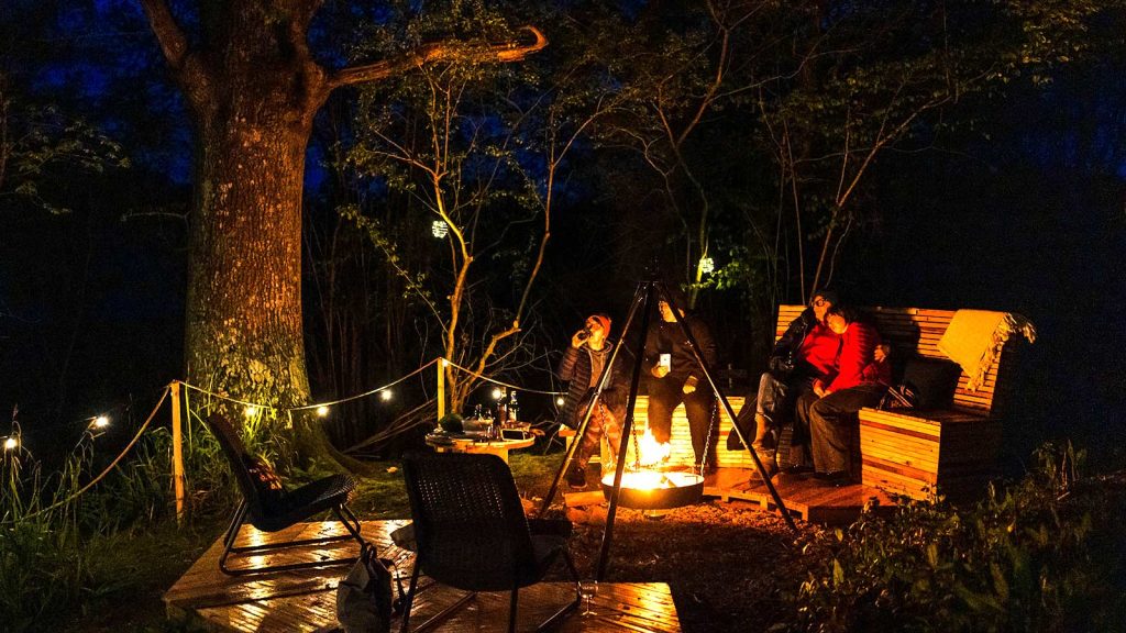 glamping-firepit-cooking-forest-area-night-anna-pumer